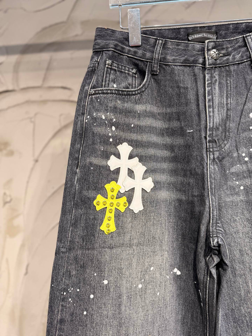 Dark gray denim pants with front and thigh area cross patches