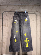 Dark gray denim pants with yellow and white cross patches on legs