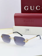 Gucci sunglasses with soft blue lenses, gold frame, tortoise temples, round logo stud