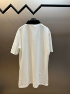 White short-sleeve polo shirt, back view with black neck trim