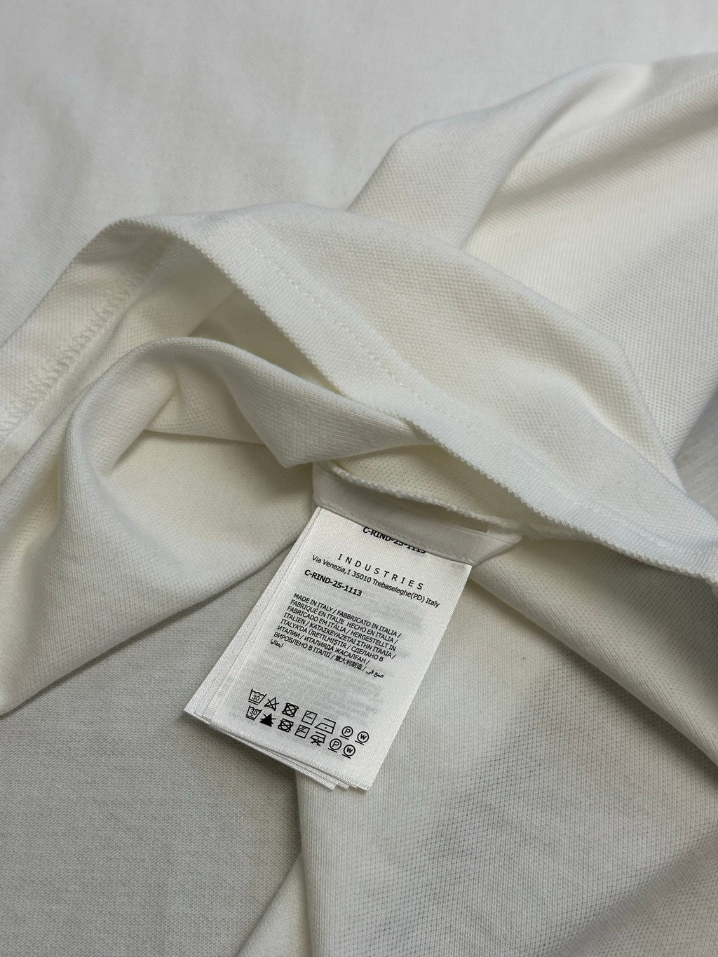 White polo fabric close-up with inner care label