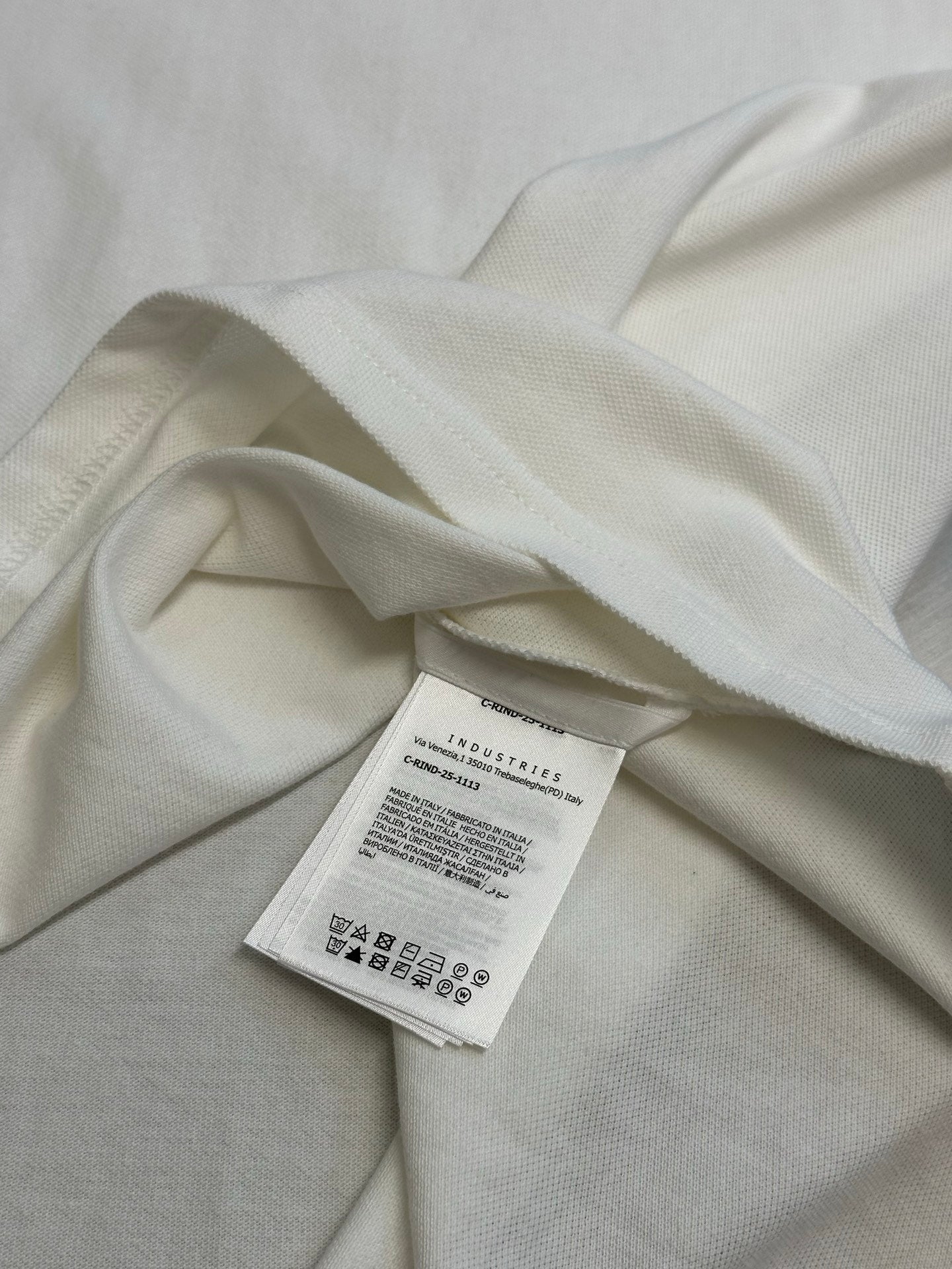 White polo fabric close-up with inner care label
