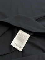 Moncler polo shirt interior label on dark navy fabric