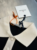 Moncler polo shirt collar detail in navy with cream trim and buttoned placket