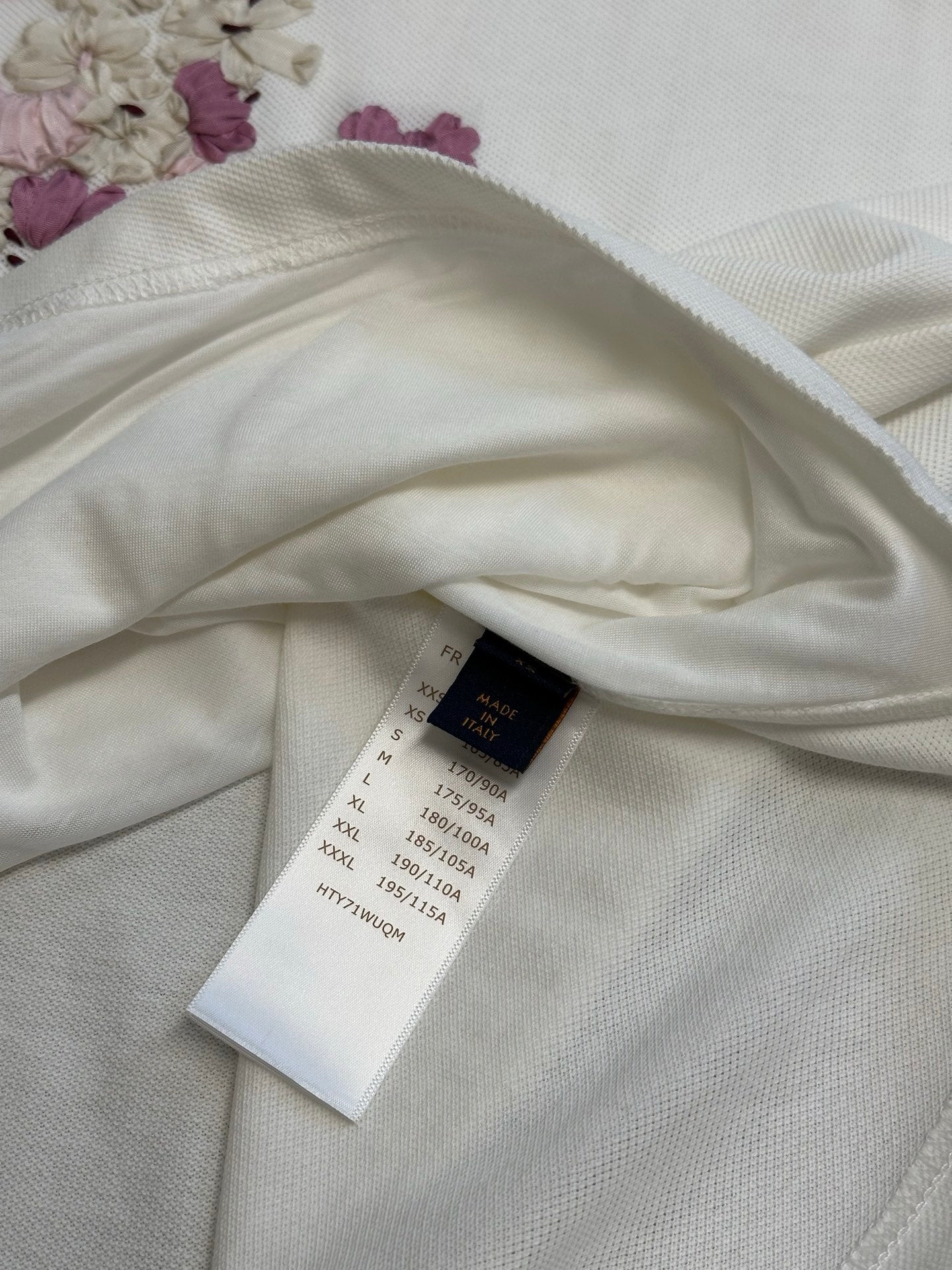 White T-shirt interior with size label on fabric