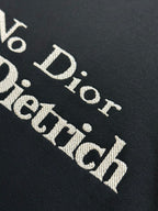 'No Dior No Dietrich' text print on black sweatshirt fabric