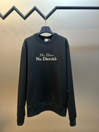 Black crewneck sweatshirt with ribbed cuffs, hem, and 'No Dior No Dietrich' print