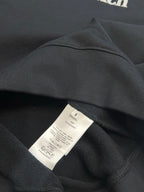 Black sweatshirt interior neckline with fabric tag and size label