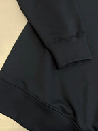 Black sweatshirt with ribbed cuff and side seam detail