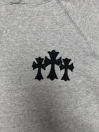 Light gray hoodie with black star-like logo on the chest