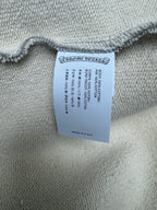 Light gray hoodie with woven brand and size label near the hem