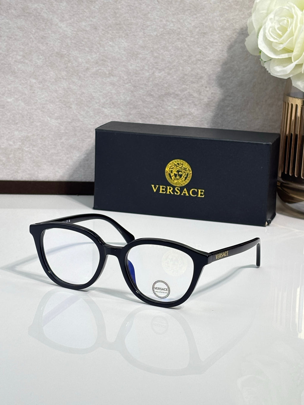 Eyeglasses with black round frames and silver-tone temples