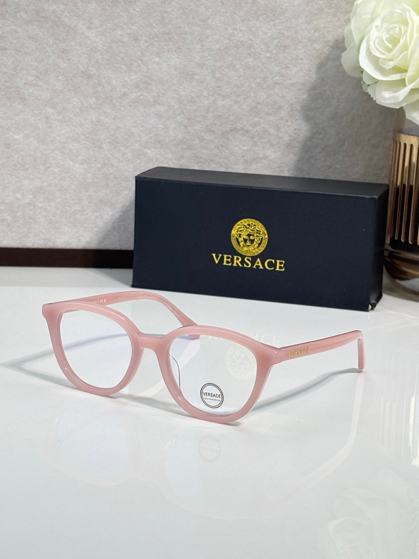 Eyeglasses with pink round frames and light pink temples