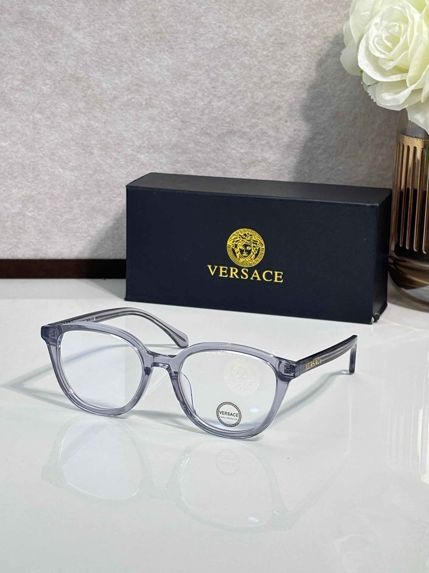 Eyeglasses with light blue round frames and silver-tone temples