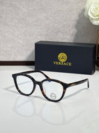 Eyeglasses with dark tortoiseshell round frames and clear temple details