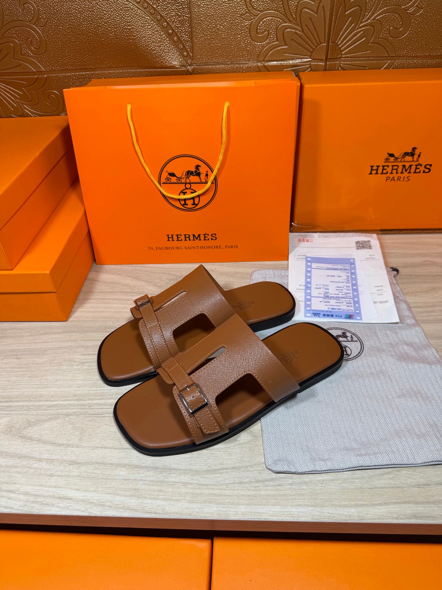 Hermes brown leather sandals, side view with double strap and metal buckle