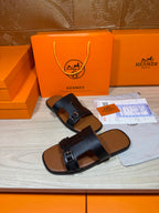 Hermes dark blue flat sandals with front cross straps and single metal buckle