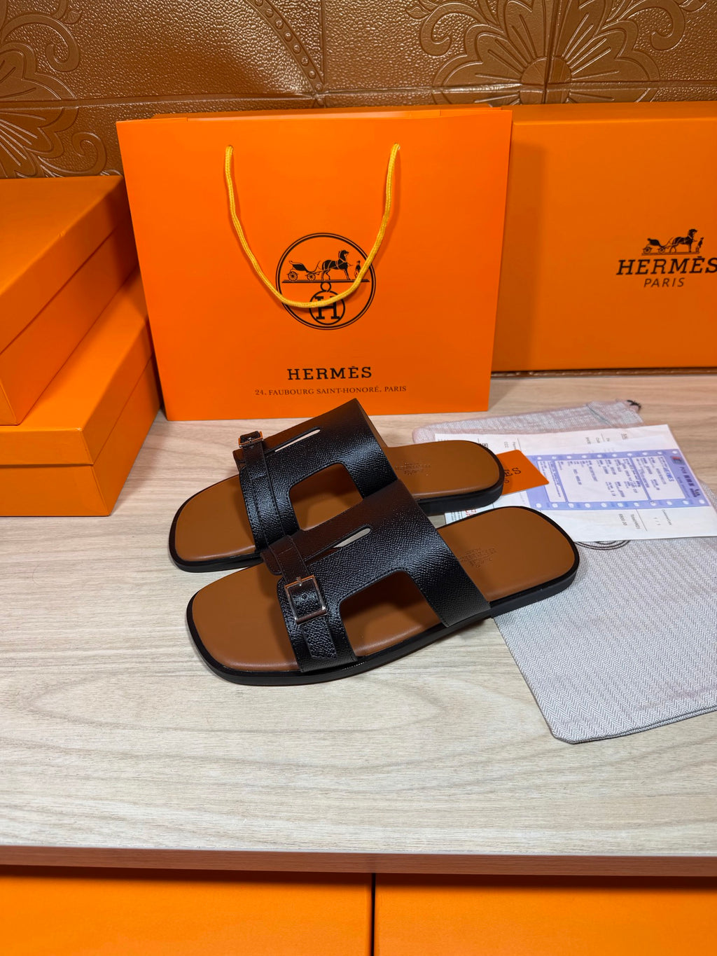 Hermes dark blue leather sandals with two wide straps and metal buckle at top