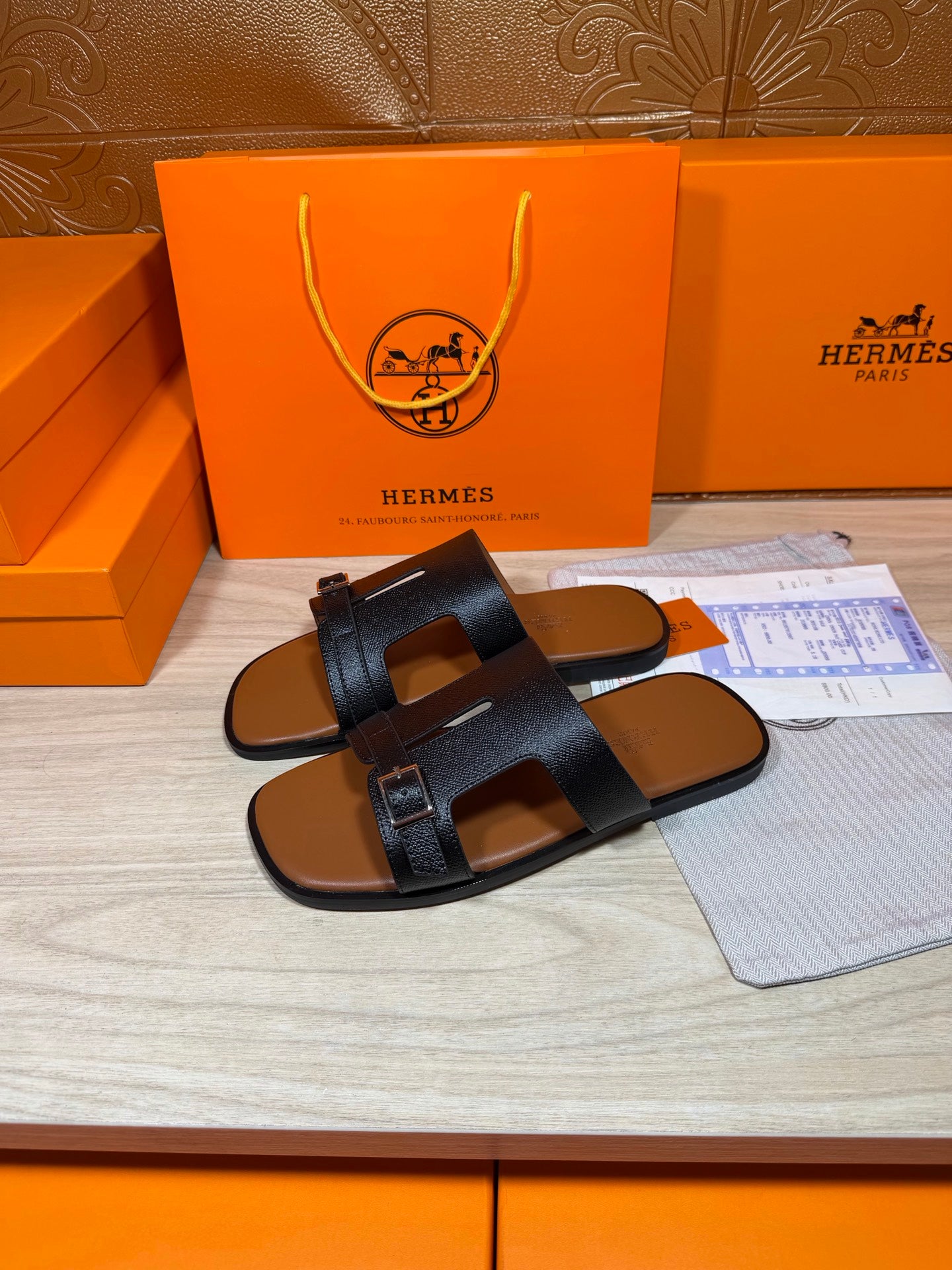 Hermes dark blue leather sandals with two wide straps and metal buckle at top