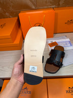 Hermes sandal outsole and dark blue strap sandal with buckle, flat rubber base