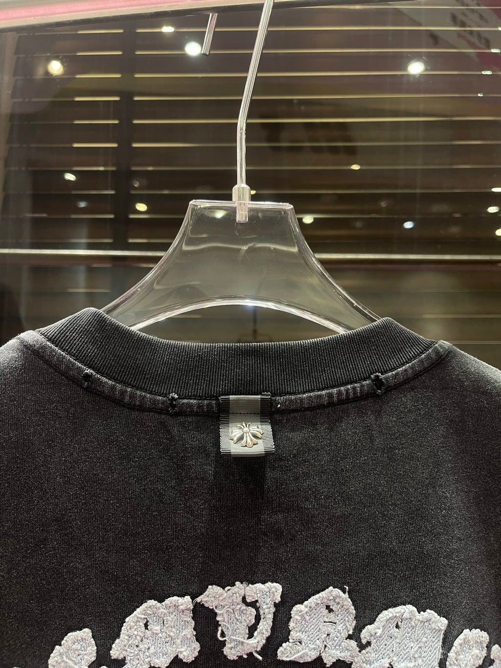 Dark charcoal crewneck T-shirt back view with neck tag detail