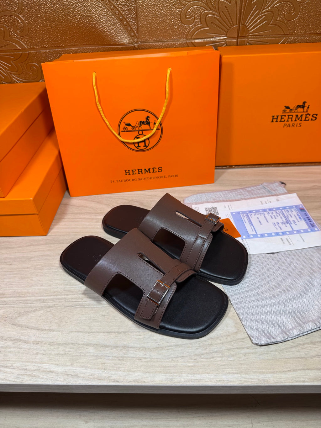 Brown leather slide sandals, open toe, two strap closures with buckles