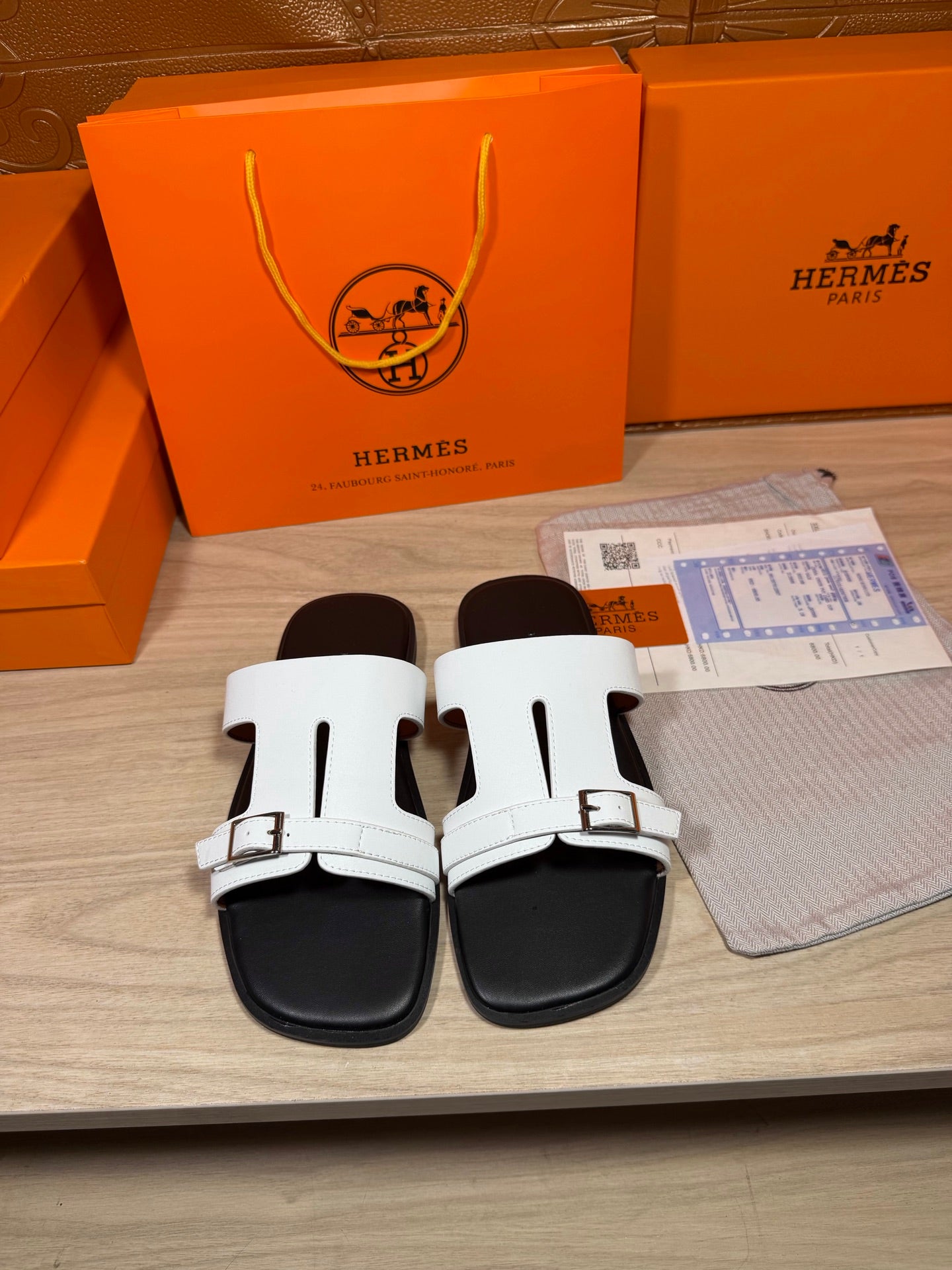 White Hermes sandals with double buckles and black rubber sole