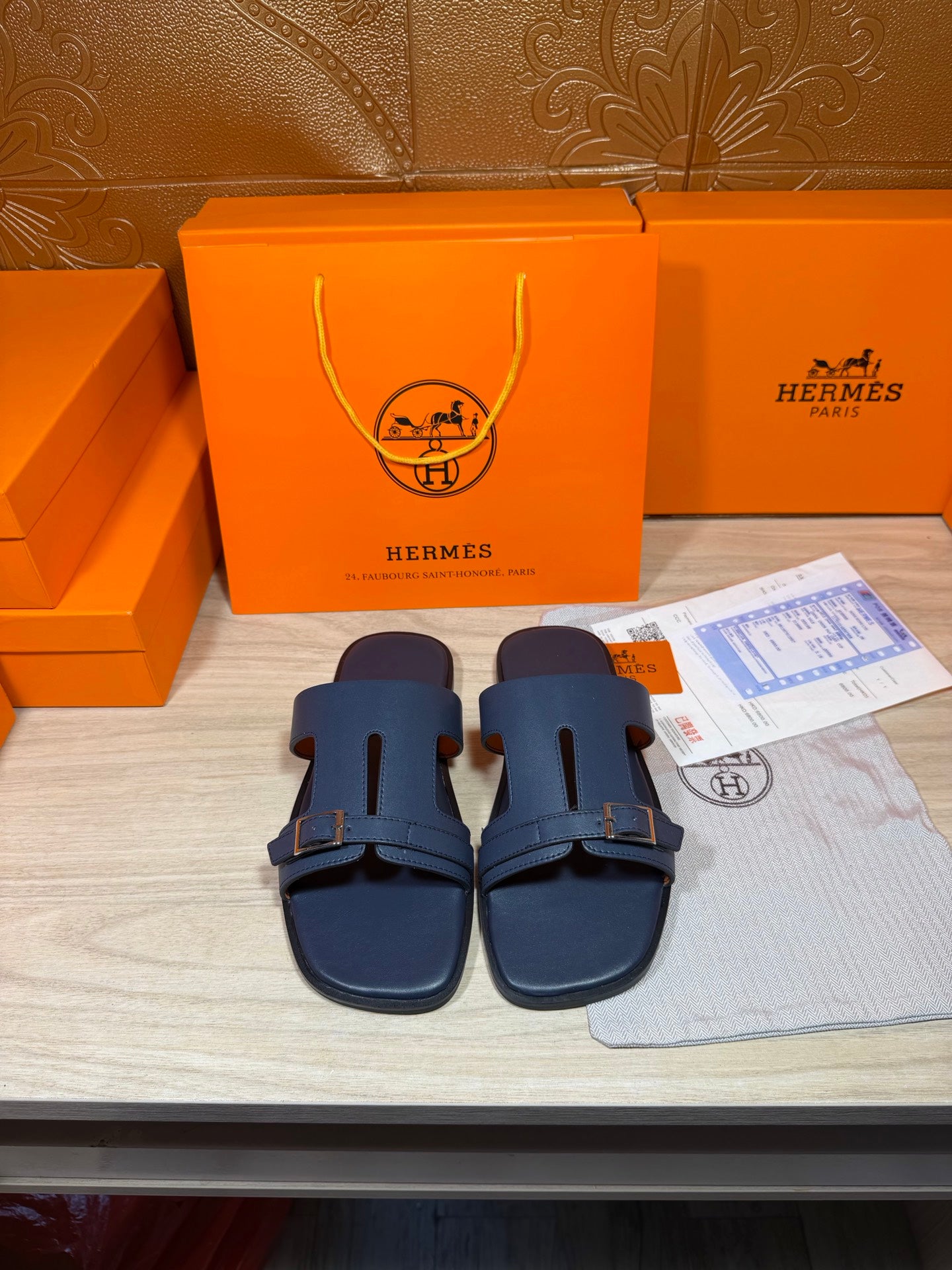 Hermes blue slide sandals with two straps and silver buckle, open toe