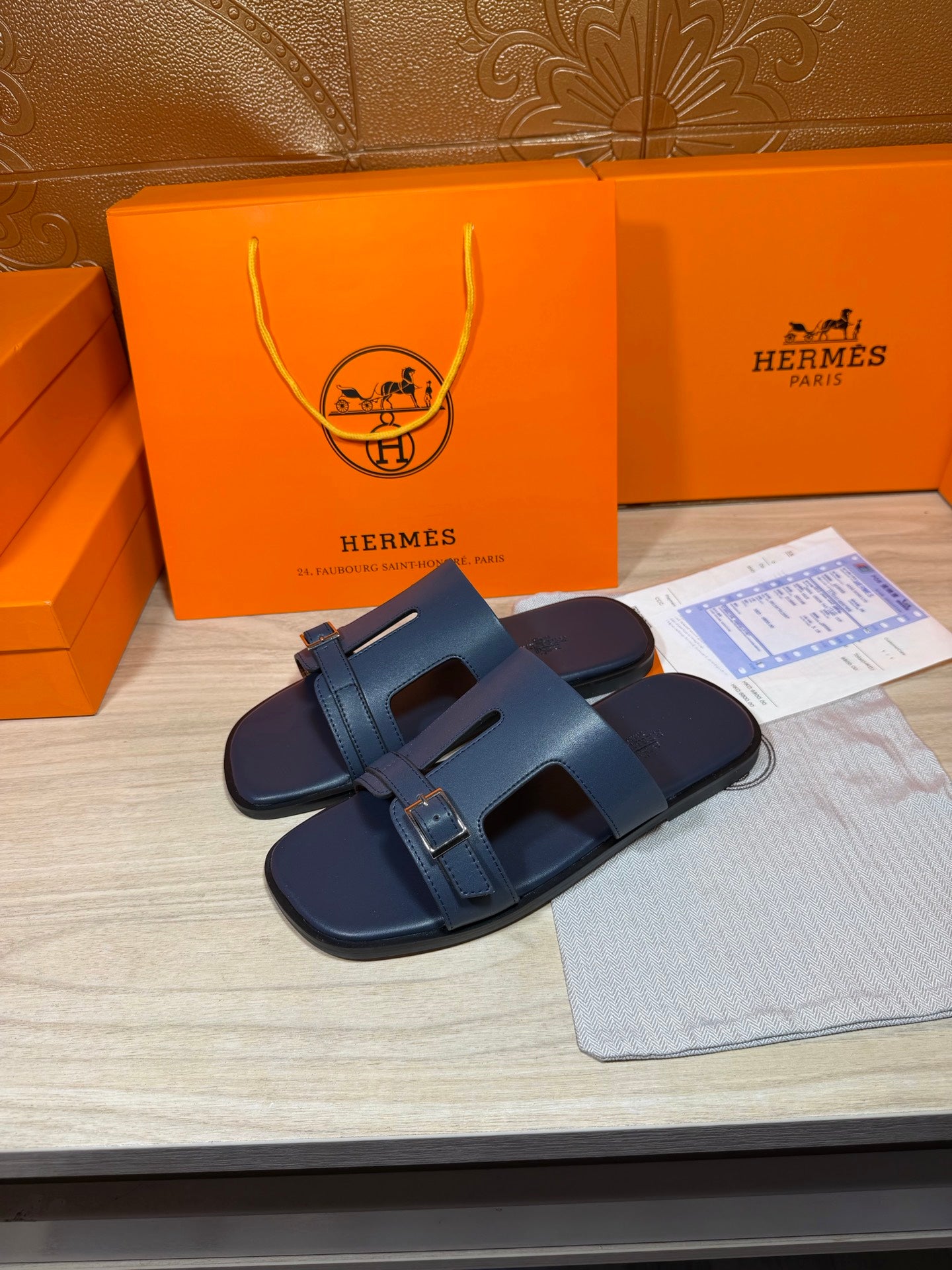Hermes blue slide sandals with adjustable strap and silver square buckle, open toe