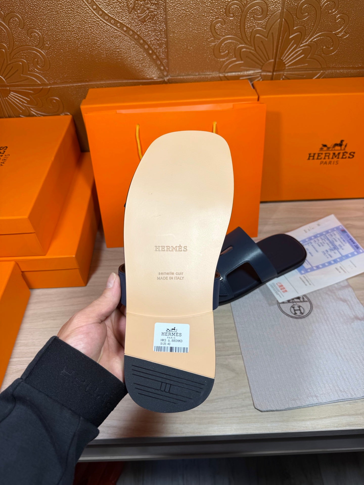 Hermes sandals outsole view, blue rubber sole with molded grip pattern