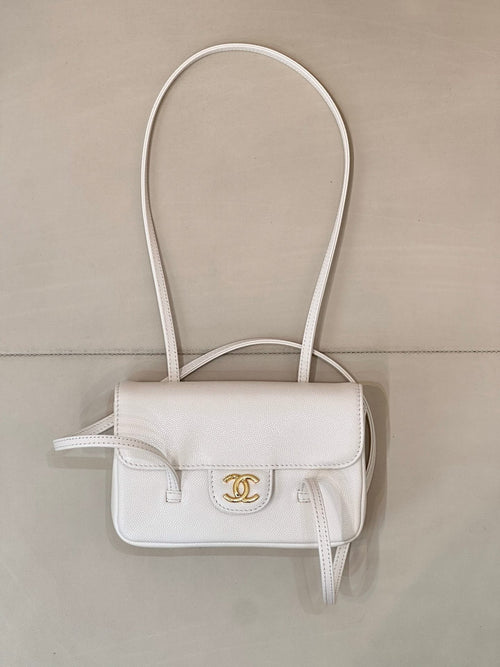 Chanel white leather mini handbag with top flap, CC logo, and loop handles