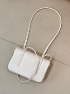Chanel white leather mini handbag with long handles and structured top silhouette
