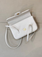 Chanel white leather mini handbag with exterior pocket and gold-tone snap detail