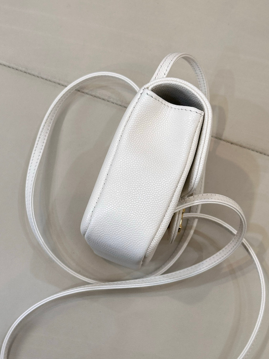 Chanel white leather mini handbag with textured finish and long detachable strap