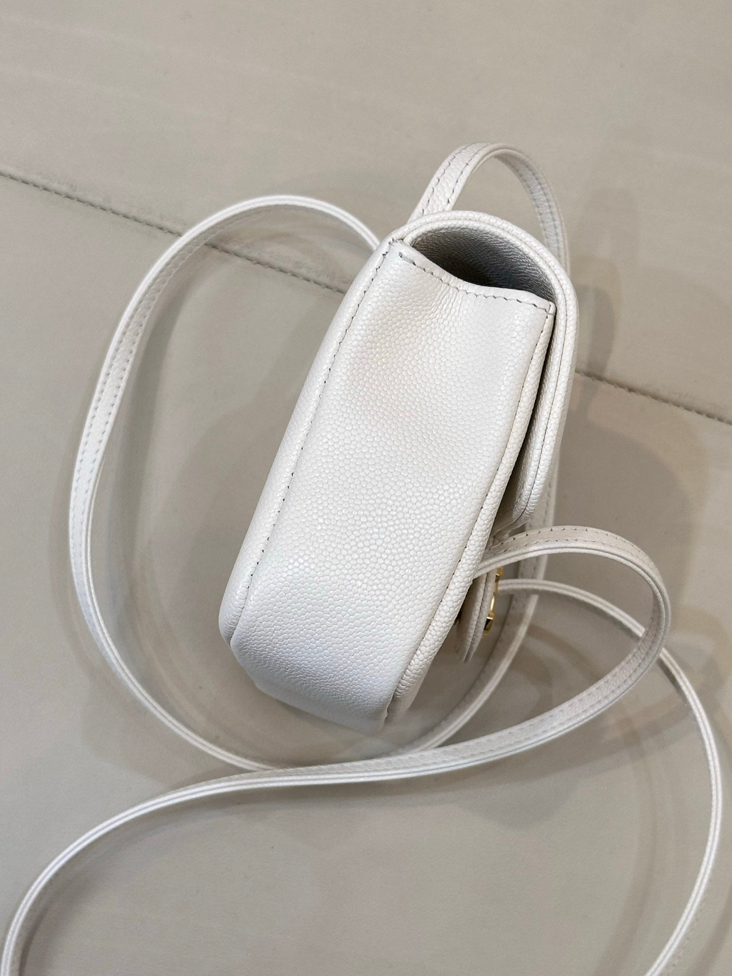 Chanel white leather mini handbag with textured finish and long detachable strap