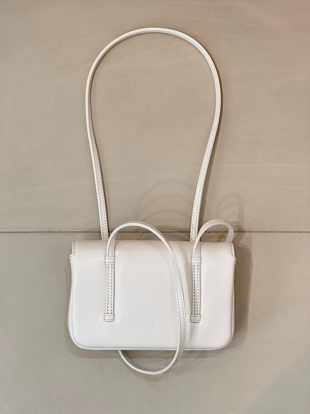 Chanel white leather mini handbag with long handles and front top opening