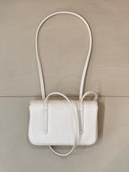 Chanel white leather mini handbag with long handles and front top opening