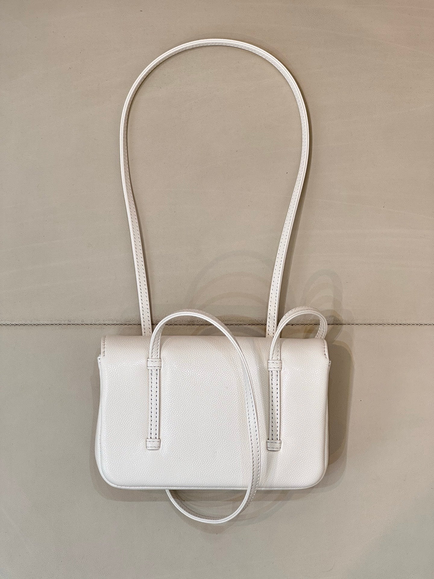 Chanel white leather mini handbag with long handles and front top opening