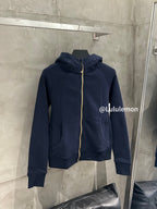 Navy zip-up hoodie with hood, gold zipper trim, and front kangaroo pocket
