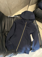Navy zip-up hoodie with hood and gold-trim zipper, folded side view
