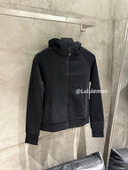 Black zip-up hoodie with hood and kangaroo pocket, front view