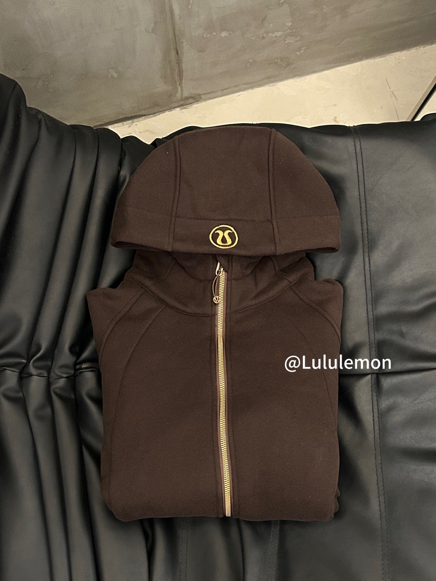Ralph Lauren brown zip-up hoodie jacket with hood and gold zipper on hanger