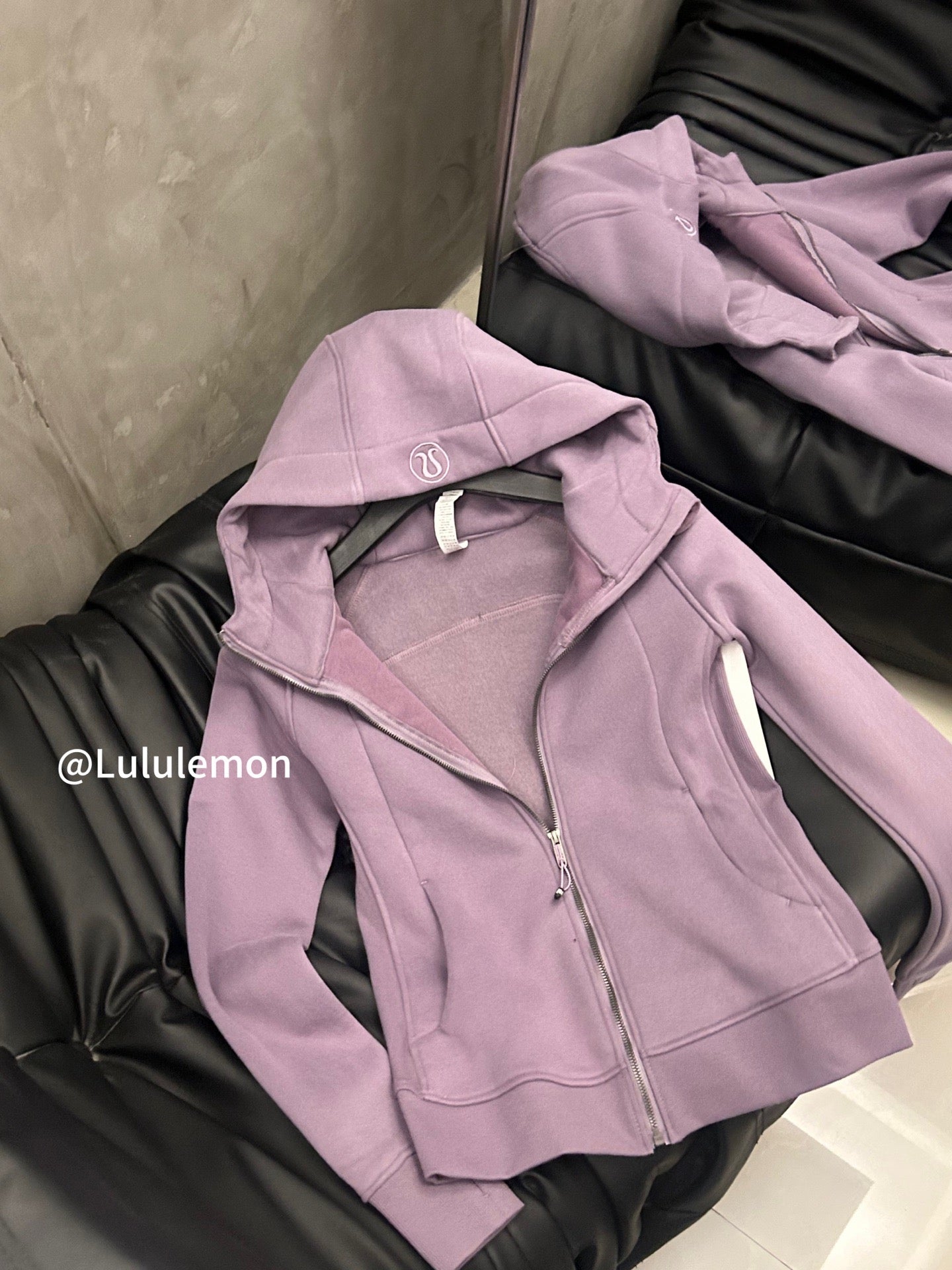 Lavender zip-up hoodie with hood and drawstring, silver zipper
