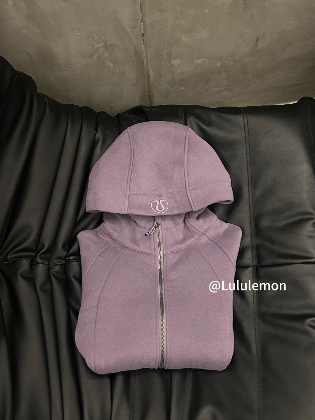 Lavender zip-up hoodie with hood and central zipper