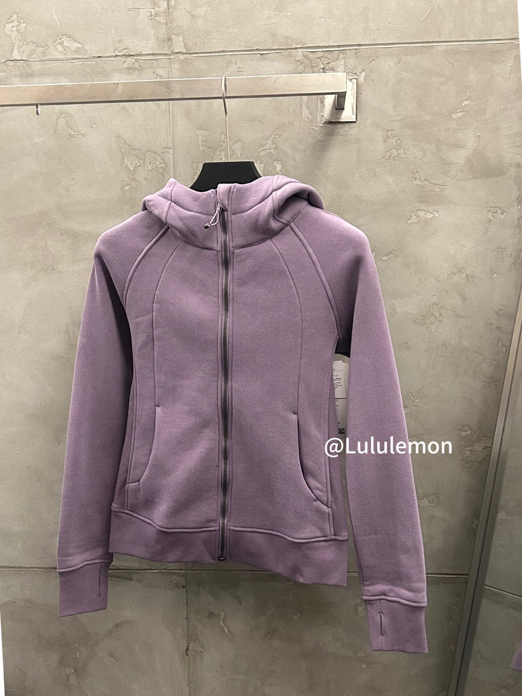 Lavender zip-up hoodie with hood, kangaroo pocket, and full-length zipper