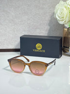 Versace sunglasses with tortoiseshell frames and tinted lenses.