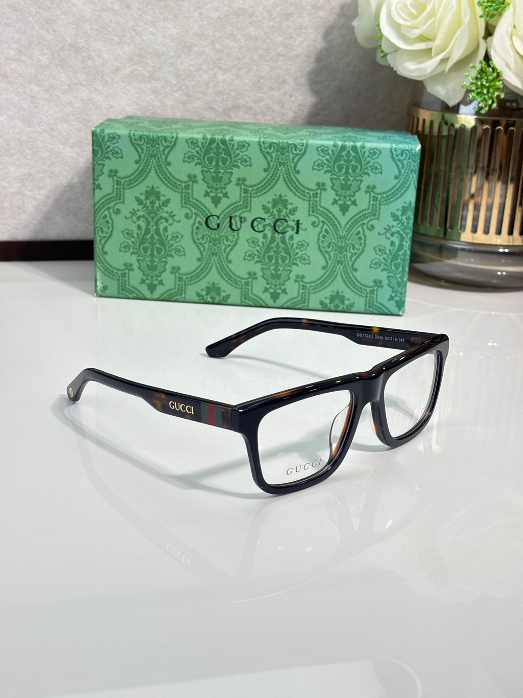 Gucci eyeglasses, dark blue frames with clear lenses and logo temples