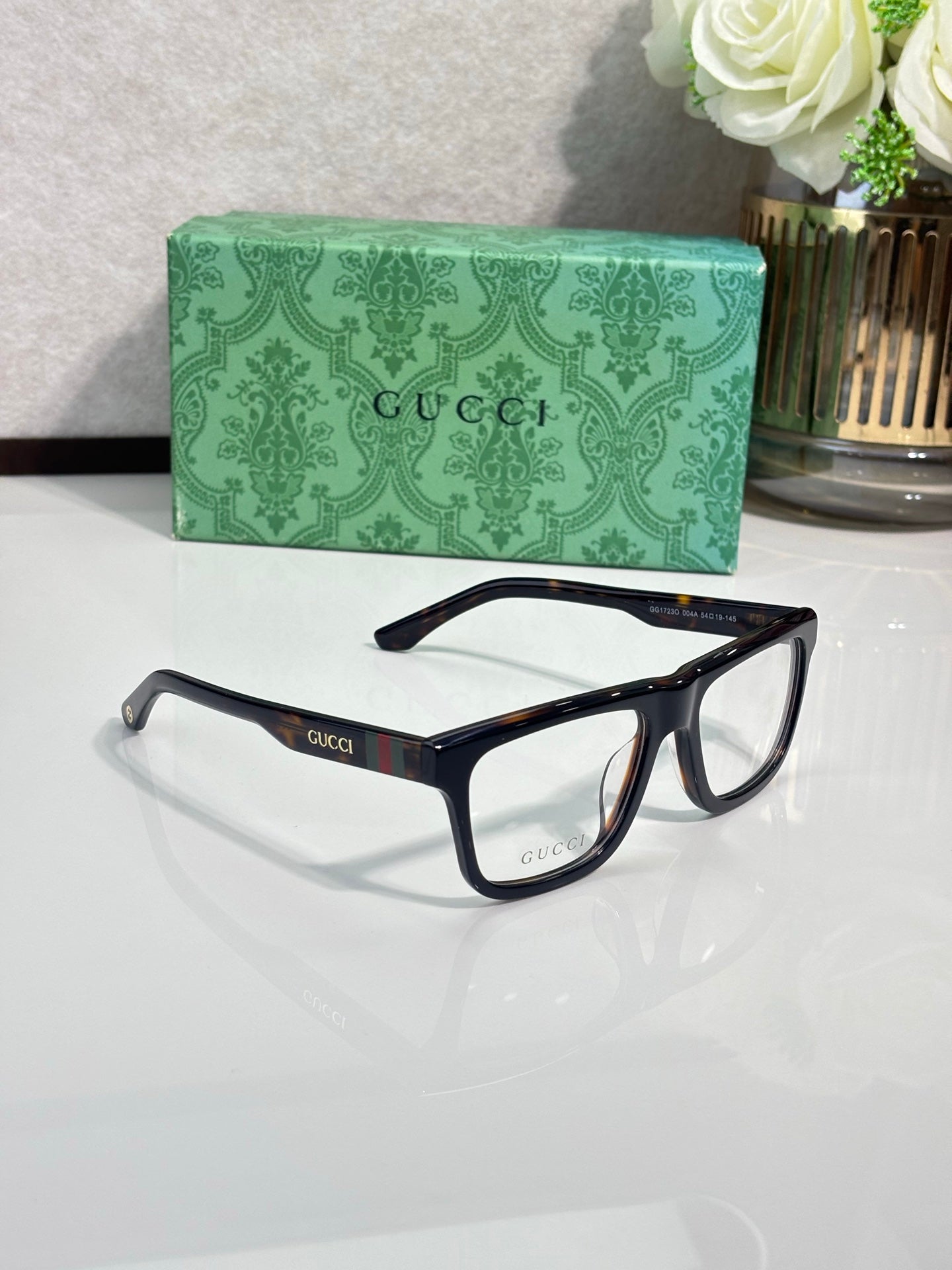 Gucci eyeglasses, dark blue frames with clear lenses and logo temples
