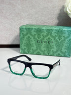 Gucci rectangular eyeglasses, dark frame, green-speckled temple tips, clear lenses
