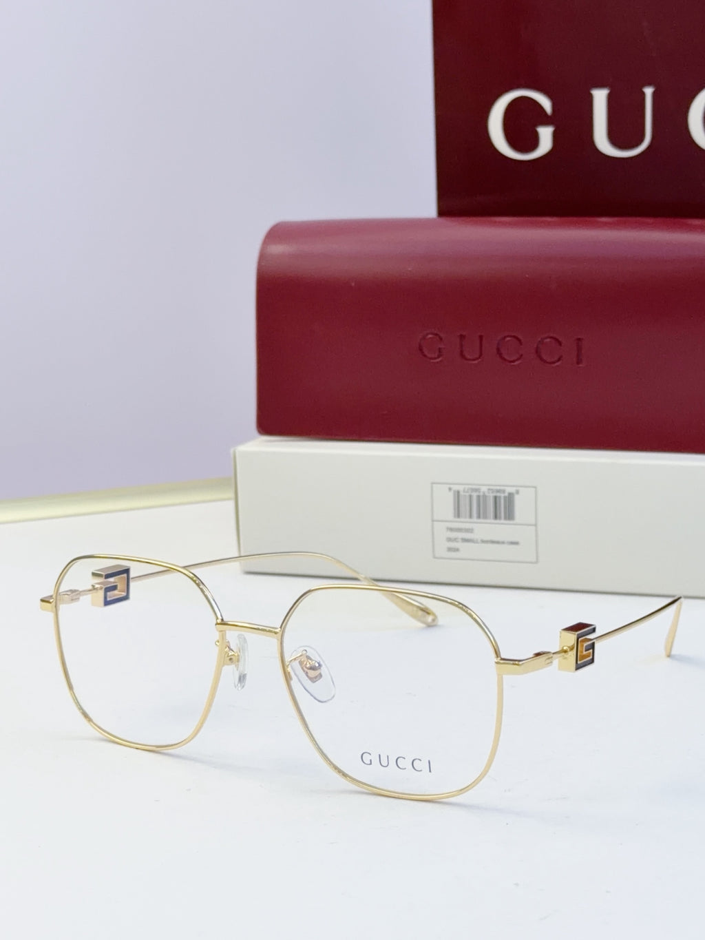 Round metal eyeglasses with gold frame and clear lenses
